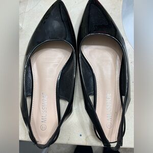 Black patent leather slingback pointy flats